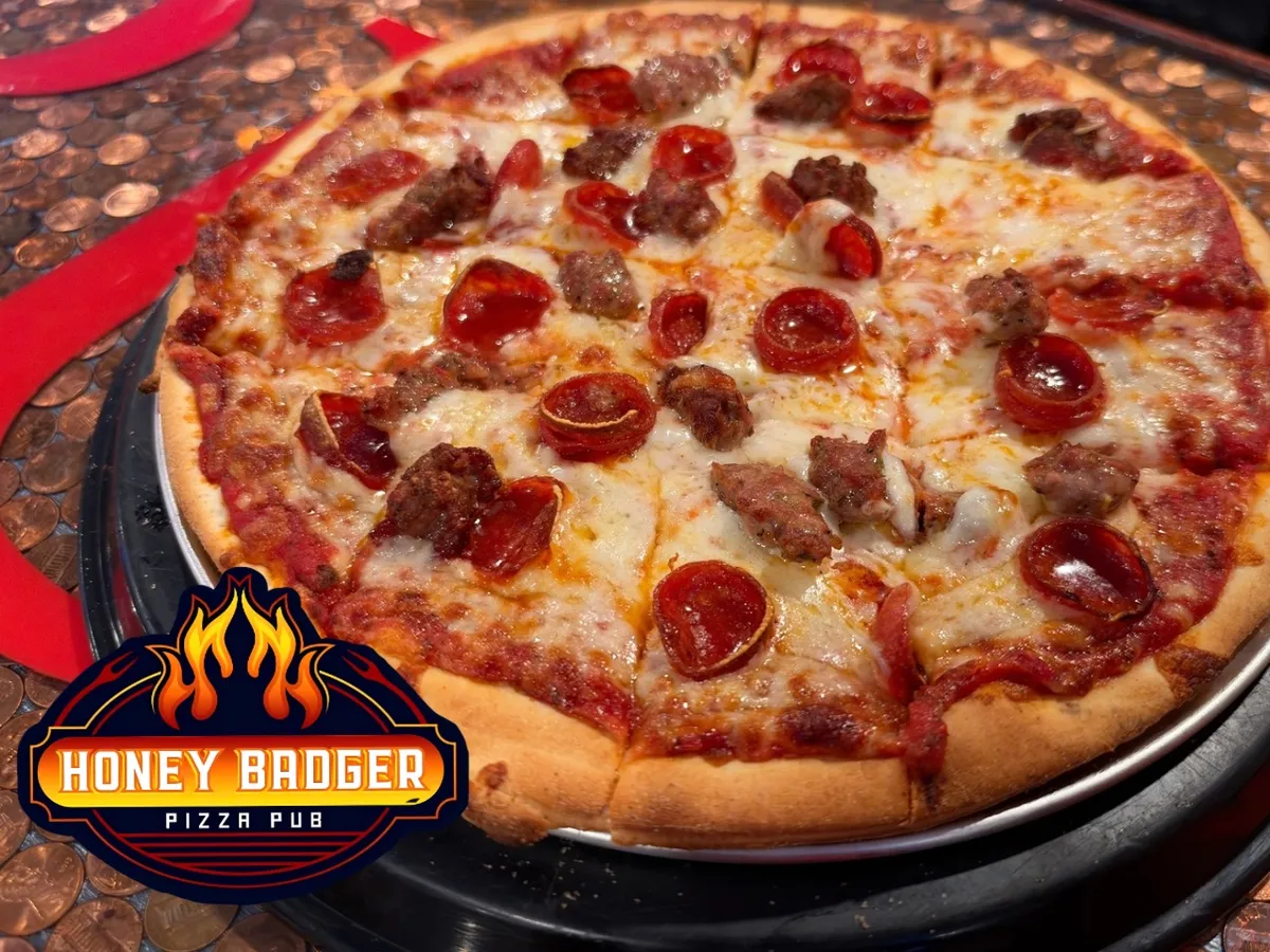 Pepperoni and sausage pizza on the bar top